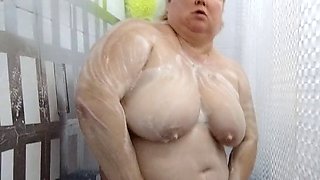 Naked stepmom with big tits and ass takes shower