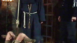 Witch Hangs Upside Down and Gets Drizzled with Black Wax