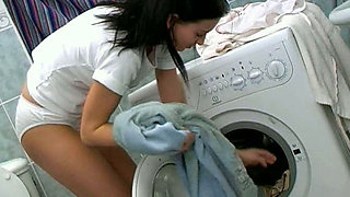 Perverted teen in white panties masturbates pussy on a washing machine