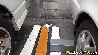 Kinky asian pees on the street