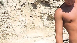 Beautiful nude beach girl enjoys a sunny day at the beach