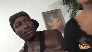 Horny, black man is rubbing his massive dick and getting ready to cum on his slut's face