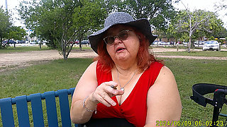 Nurse Vicki Smoking in the Park on a Bench All Dressed up