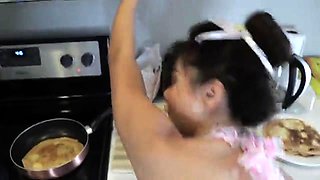 Sensuous Asian wife in lingerie fucks a dildo in the kitchen