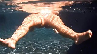 An awesome BBW babe Cherry Brady swims in the pool with boobs naked