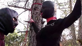 tied to a tree,  rammed in her throat