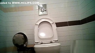Women pee in public toilet 2414