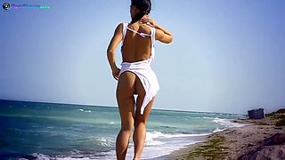 Honey Demon thinks erotic thoughts as she ambles on the beach