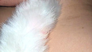 My ass is plugged with a foxtail while he fucks my pierced pussy hard