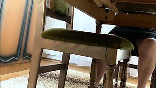 My mother in law spreads her legs under the desk