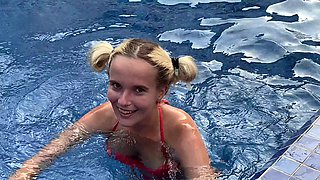 Blonde bombshell with natural tits blows a huge dick outside by the pool