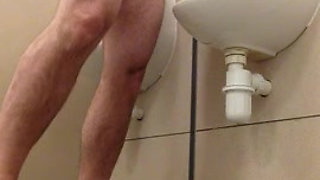 Naked Urinal wank.