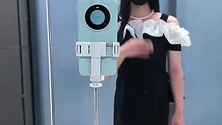 Chinese t-model in black cock-squeezing microskirt finishes off at the door of public rest room