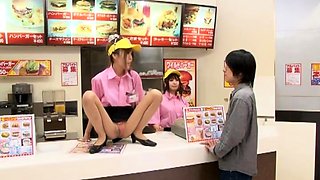 Two playful Japanese girls teasing and pleasing a meat stick