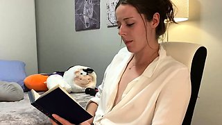 Voyeur of sexy brunette reading a hot romance novel and