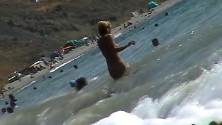 Voyeur video of nude girls having fun on a nudist beach