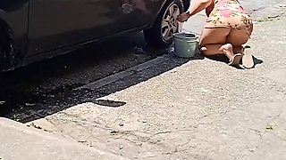HOT GIRL WASHES HER CAR SHOWING OFF ON THE STREET