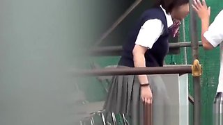 Naughty Japanese schoolgirls pissing in secret public place