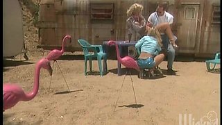 Busty blondes with glasses share a cock in a trailer park