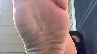 MILF in fishnet enjoys foot fetish
