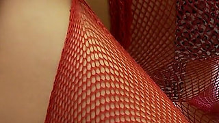 Dirty brunette in fishnets gets banged by a dick through a glory hole after sucking it