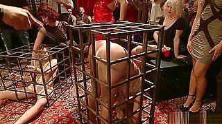 Blonde slaves in cages fucked in party