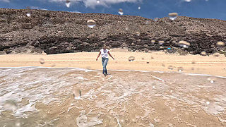 Girl Wetting Jeans in the Ocean and Swimming in Wet White T-shirt